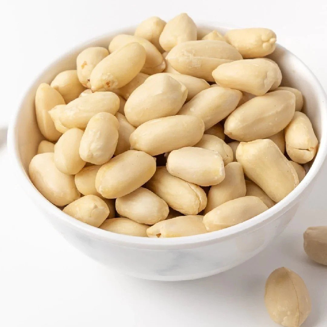 Blanched peeled peanut kernels in a bowl — supplied by KPRS Foods